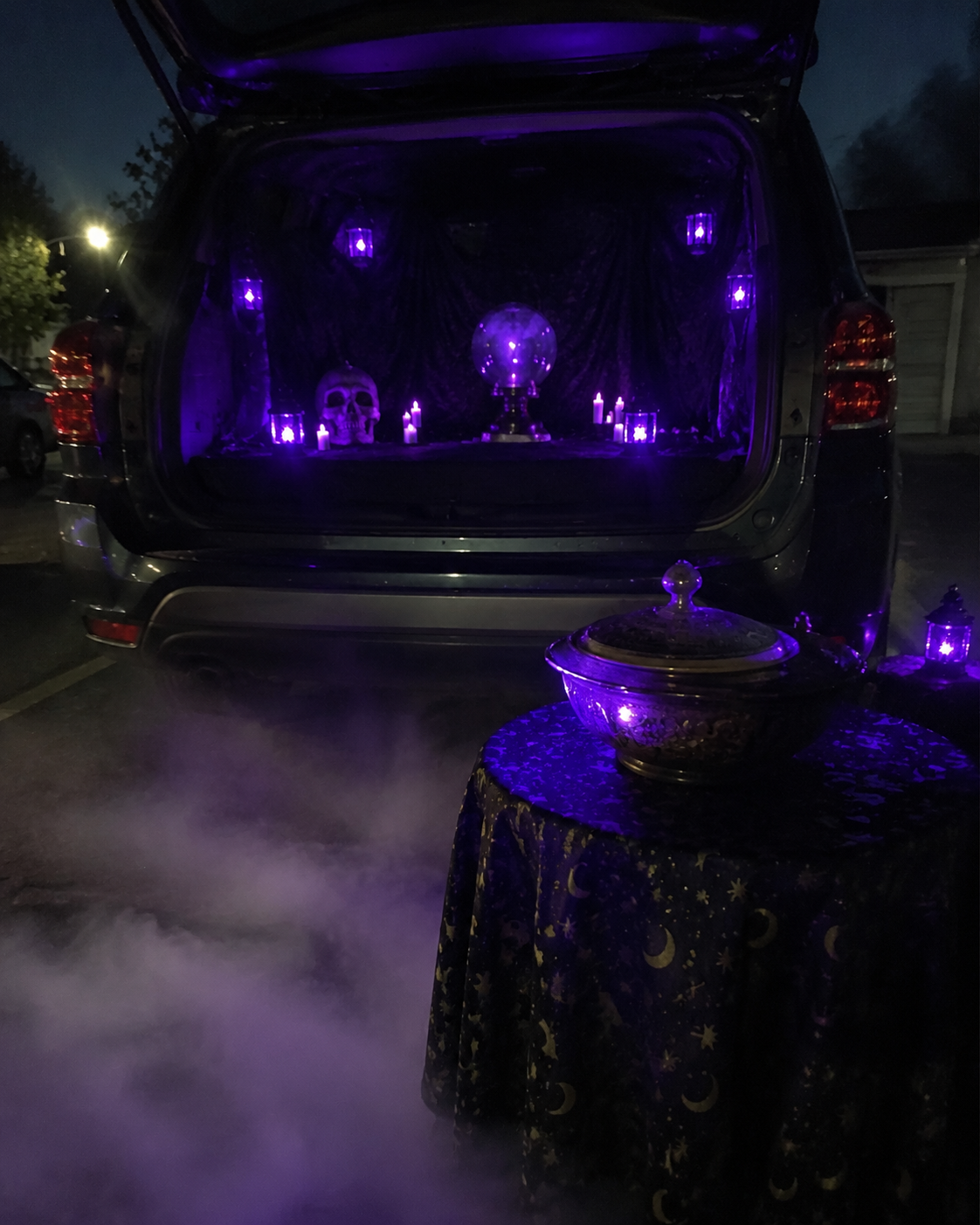 Spooky-purple-lit-Halloween-fortune-teller-setup.-trunk-or-treat-decorating-ideas